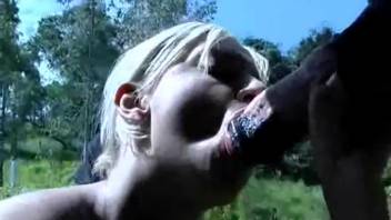 Blonde vixen eagerly slurping on a stud's massive dick