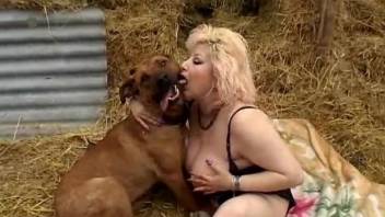 Racy woman with fantastic boobs has oral sex with dog