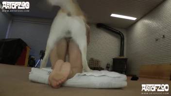 Nude lady intensely penetrated by the canine in her pierced vagina