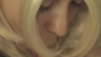 Wig-wearing blonde zoophile addict enjoys dog cock BJs