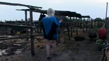 Blonde MILF shoves a massive horse cock into her pierced snatch
