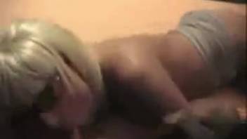 Sunglasses-clad blonde can't get enough of bestiality oral sex