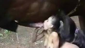 Naked babe tries a long horse penis in her tiny peach