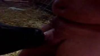 Eager farm animal sucking on a guy's floppy cock