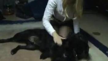 Blond-haired babe shows her deepthroat skills with a dog