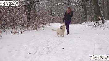 Frizzy-haired babe fucks a dog in a snowy forest
