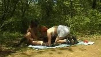 Outdoor threesome with two sluts and their black dog