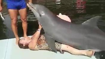 Cuban granny getting humped by a sexy dolphin