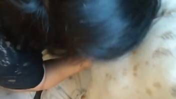 Dark-haired lady in black outfit blowing like a slut