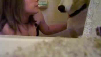 Sexy young zoophile kisses her sexy doggy in hot zoo vid