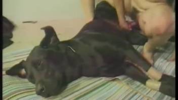 Aroused female engages in sex with a canine in kinky household scenes from unfiltered animal erotic content