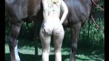 Busty blonde gets her asshole fucked by a horny horse